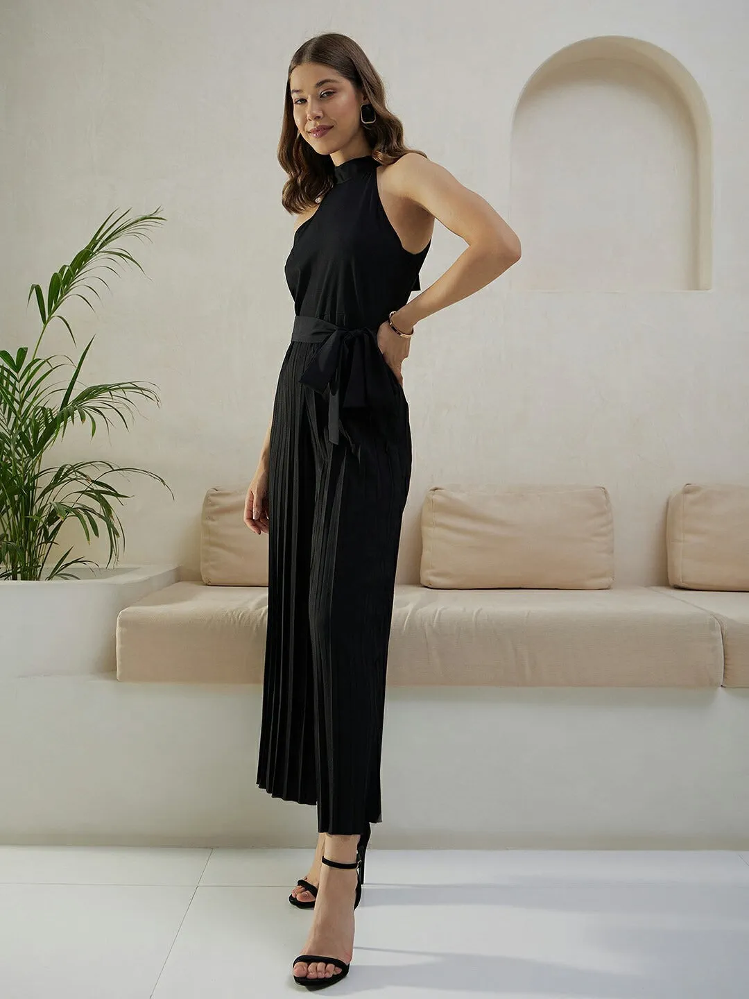 Berrylush Women Solid Black Halter Neck Sleeveless Waist Tie-Up Pleated Culotte Jumpsuit