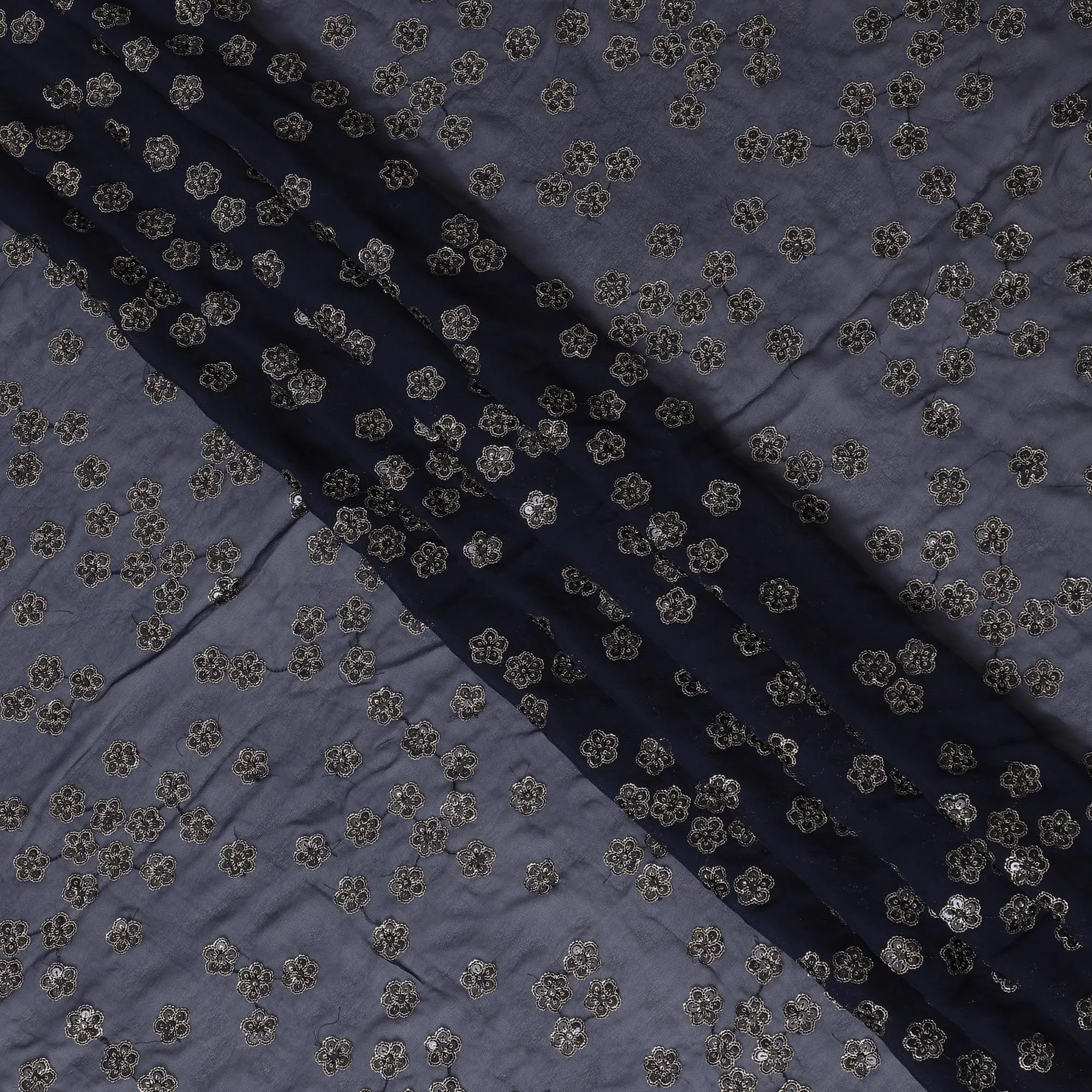 Navy blue synthetic georgette fabric with gold and black sequins in floral design-D15816